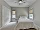Neutral toned bedroom, with a comfortable bed, closet and bright windows allowing lots of light at 1839 Kent Ave, Atlanta, GA 30338