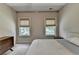 Neutral toned bedroom, with a comfortable bed, closet and bright windows allowing lots of light at 1839 Kent Ave, Atlanta, GA 30338