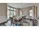 Formal dining room with large windows, a stylish chandelier, and seating for eight at 1839 Kent Ave, Atlanta, GA 30338
