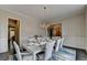 Spacious dining room with a chandelier, light walls, and a view into other living spaces at 1839 Kent Ave, Atlanta, GA 30338