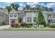 Beautiful two-story home featuring a brick exterior, manicured lawn, and tasteful landscaping at 1839 Kent Ave, Atlanta, GA 30338