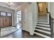 A stunning home foyer with hardwood floors and staircase at 1839 Kent Ave, Atlanta, GA 30338