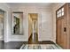 Elegant foyer with hardwood floors, white trim, and a decorative mirror creating an open feel at 1839 Kent Ave, Atlanta, GA 30338