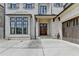 Welcoming entryway with a wood front door, brick facade, and an attached garage at 1839 Kent Ave, Atlanta, GA 30338