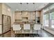 Bright kitchen featuring stainless steel appliances, a center island with seating, and plenty of natural light at 1839 Kent Ave, Atlanta, GA 30338