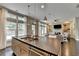 Well-appointed kitchen featuring an island with a sink and stainless steel appliances, open to the living room at 1839 Kent Ave, Atlanta, GA 30338