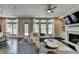 Bright living room features a fireplace, built-ins, large sectional, and many windows at 1839 Kent Ave, Atlanta, GA 30338