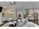 Open-concept living room offers seamless transition to the kitchen and staircase at 1839 Kent Ave, Atlanta, GA 30338