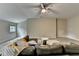 Bright living room with ample space, a ceiling fan, sectional seating, and area rug at 1839 Kent Ave, Atlanta, GA 30338