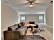 Cozy living room with modern sectional sofa, ceiling fan, and large area rug at 1839 Kent Ave, Atlanta, GA 30338