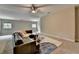 Spacious living room with a ceiling fan, large window and a comfortable sectional sofa at 1839 Kent Ave, Atlanta, GA 30338
