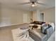 A comfortable living room with a ceiling fan, a modern sectional sofa, and a large area rug at 1839 Kent Ave, Atlanta, GA 30338
