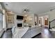 Bright living room features a fireplace, built-ins, large sectional, and many windows at 1839 Kent Ave, Atlanta, GA 30338
