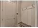 Practical mudroom area with a coat rack, bench seating, and a door at 1839 Kent Ave, Atlanta, GA 30338