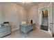 A home office space with a modern desk, storage cabinet, and view of the staircase at 1839 Kent Ave, Atlanta, GA 30338