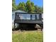 The home's back deck with dark painted railings offer a relaxing spot to enjoy the outdoors at 320 White Birch Dr, Covington, GA 30016