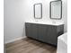 A bathroom features double vanity with modern fixtures and ample storage at 320 White Birch Dr, Covington, GA 30016