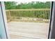 This outdoor deck space features a wooden railing, providing a perfect spot for relaxation at 320 White Birch Dr, Covington, GA 30016