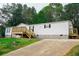Charming one-story home boasts a lovely front porch and well-maintained landscaping at 320 White Birch Dr, Covington, GA 30016