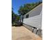 The house features a back deck, great for enjoying the outdoors with dark painted railings and stairs at 320 White Birch Dr, Covington, GA 30016