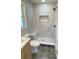 Beautiful bathroom featuring a marble tile shower with built-in bench and recessed niche at 323 W Claiborne Ct, Marietta, GA 30066