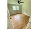 A serene bedroom with hardwood floors, neutral walls, and a window offering natural light at 323 W Claiborne Ct, Marietta, GA 30066