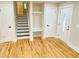 Spacious entryway with hardwood floors, a coat rack, and a beautiful front door with sidelight at 323 W Claiborne Ct, Marietta, GA 30066