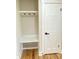 A well-organized entryway features a built-in bench and coat rack for practical storage and convenience at 323 W Claiborne Ct, Marietta, GA 30066