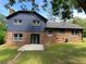 Brick and siding with dark roof and mature trees provide excellent shade at 323 W Claiborne Ct, Marietta, GA 30066