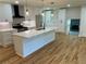 Bright, spacious kitchen with quartz countertops, a large island, and stainless steel appliances at 323 W Claiborne Ct, Marietta, GA 30066