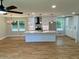 Bright, open kitchen featuring a large island, sleek white cabinets, and stainless steel appliances at 323 W Claiborne Ct, Marietta, GA 30066