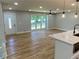 Bright, open living space with hardwood floors, large windows, and modern lighting fixtures at 323 W Claiborne Ct, Marietta, GA 30066