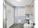 Bathroom with outside access, walk in shower and modern sink at 7590 Chaparral Dr, Atlanta, GA 30350