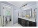 Bright bathroom featuring dual sinks, shower, and modern fixtures at 7590 Chaparral Dr, Atlanta, GA 30350