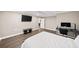 Bedroom in basement features a comfortable bed, desk, and plenty of light from windows at 7590 Chaparral Dr, Atlanta, GA 30350
