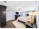 Bright bedroom featuring stylish furniture, tv and neutral decor at 7590 Chaparral Dr, Atlanta, GA 30350