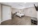 Bedroom in basement features a comfortable bed, desk, and ample natural light from two windows at 7590 Chaparral Dr, Atlanta, GA 30350