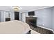 Comfortable bedroom with stylish furniture, tv and neutral decor at 7590 Chaparral Dr, Atlanta, GA 30350