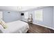 Bright bedroom with ample natural light, wood floors, and calming color scheme, creating a serene atmosphere at 7590 Chaparral Dr, Atlanta, GA 30350