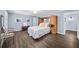 Calm bedroom with wood floors, hutch headboard, and soft blue walls that offers a relaxing retreat at 7590 Chaparral Dr, Atlanta, GA 30350