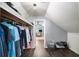 Organized walk-in closet with clothing racks and shoe storage, leading to bright office space at 7590 Chaparral Dr, Atlanta, GA 30350