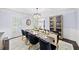 Bright dining room with seating for six, detailed trim work and modern buffet at 7590 Chaparral Dr, Atlanta, GA 30350