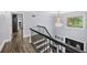 Spacious entry foyer with dark wood staircase and chandelier at 7590 Chaparral Dr, Atlanta, GA 30350