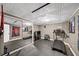 Basement gym area featuring a mirrored wall, fitness equipment, and rubber flooring at 7590 Chaparral Dr, Atlanta, GA 30350