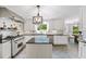 Kitchen with stainless appliances, white cabinets, dark countertops and tile floors at 7590 Chaparral Dr, Atlanta, GA 30350