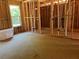View of bathroom construction and framing with rough cut floors and pipes in the wall at 95 Cambridge Dr, Covington, GA 30014
