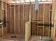 View of bathroom framing during construction, exposed plumbing, rough cut floors and exposed HVAC ducting at 95 Cambridge Dr, Covington, GA 30014
