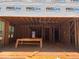 View of new construction of living room with exposed framing, rough cut floors and ladder at 95 Cambridge Dr, Covington, GA 30014