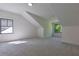 Finished attic with carpet, white walls, natural light from the windows, and contemporary lighting at 136 Beutell St, Norcross, GA 30071