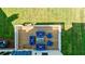 Aerial view of a deck with blue outdoor seating overlooking a lush green lawn perfect for relaxing at 136 Beutell St, Norcross, GA 30071